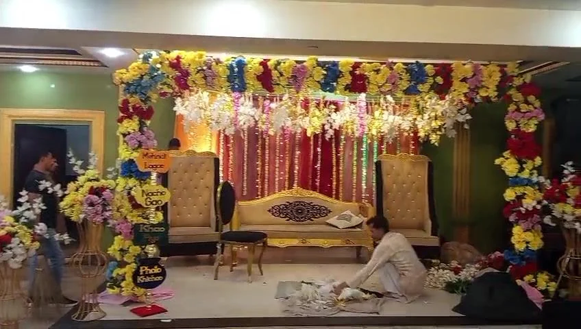 Our crew hanging florals before a Mehndi night